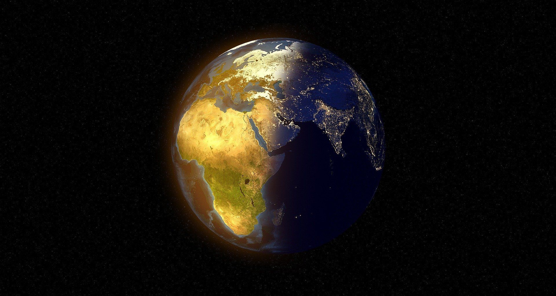 Planet earth as seen from space, half in daylight, and half in the dark of night. Sunlight over African continent.